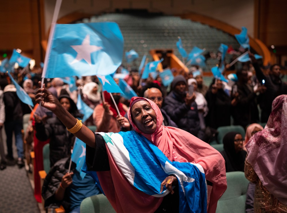 Members of the Somali community await the arrival of the president of Somalia at the Minneapolis Convention Center in Minneapolis.