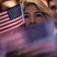 People celebrate becoming U.S. citizens at a naturalization ceremony in Riverside, C.A.