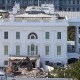 An excavator works to clear rubble after the East Wing of the White House was demolished on Oct. 23, 2025.
