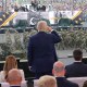 President Donald Trump salutes Army troops on the National Mall.