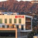 An aerial view of the Netflix logo displayed at Netflix studios, with the Hollywood sign in the distance, on Dec. 5, 2025, in Los Angeles.
