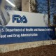 A sign for the U.S. Food and Drug Administration in Silver Spring, M.D., as seen through a prism on April 8, 2025.