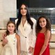Mandana Dayani poses with her daughters after being sworn in as a trustee to the U.S. Holocaust Memorial Council on Dec. 8.