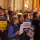 Demonstrators protest at the Indiana Statehouse in Indianapolis, I.N., on Dec. 11, 2025.