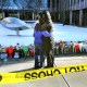 People hug in front of a memorial at Brown University.