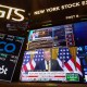 A television broadcasts President Donald Trump’s tariff news on the floor of the New York Stock Exchange.