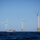 A boat passes in front of the Ørsted Block Island Wind Farm off Block Island, R.I., on Sept, 14, 2016.