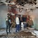 People inspect the scene of a deadly bomb explosion inside a mosque on Dec. 25 in Maiduguri, Nigeria.