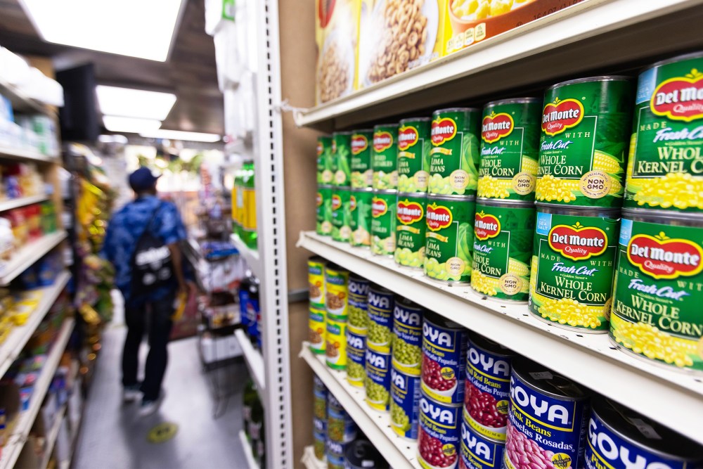 Canned food and other products in an aisle at a grocery store in NY