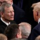 President Donald Trump greets Chief Justice John Roberts before he addresses a joint session of Congress at the U.S. Capitol.