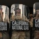 California National Guard stand behind shields on the steps of the Federal Building in Los Angeles.