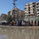 Civilians evacuate an area in Aleppo, Syria, Saturday, Jan. 10, 2026.