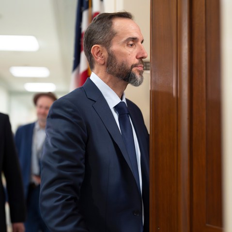 Former Department of Justice Special Counsel Jack Smith enters a room.