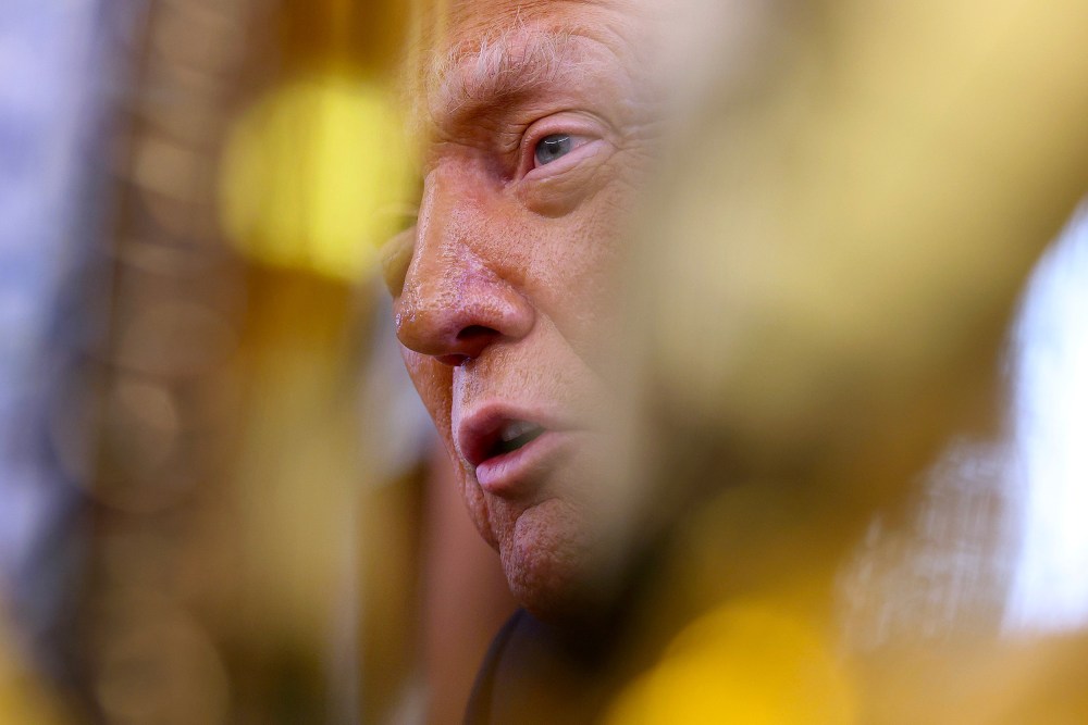 President Donald Trump with his face partially obscured.