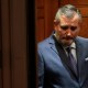 Texas Sen. Ted Cruz looks down as he stands in an elevator in the U.S. capitol.