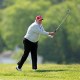 Donald Trump playing golf.