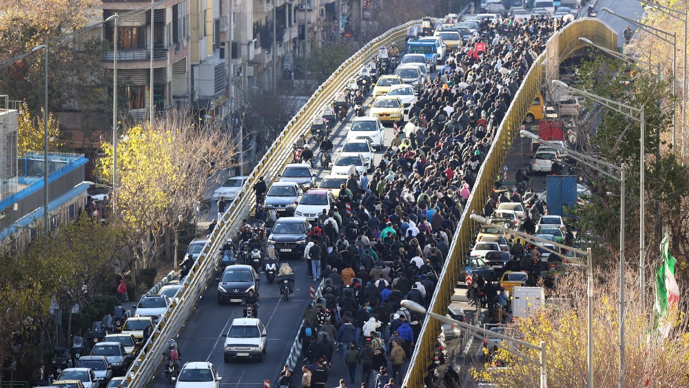 Protesters march in downtown Tehran on Dec. 29.