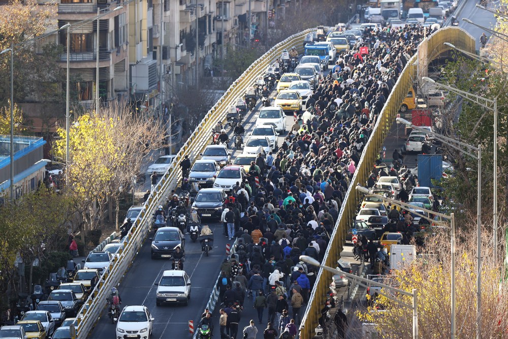 Protesters march in downtown Tehran on Dec. 29.