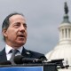 Jamie Raskin speaks at a podium in front of the US Capitol.