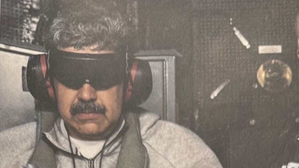 A person blindfolded.