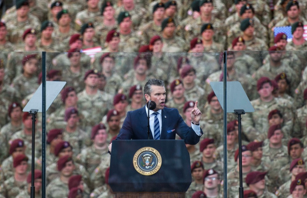 Pete Hegseth in front of a crowd of soldiers.