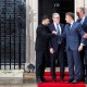 British Prime Minister Keir Starmer (second from left) says goodbye to Ukrainian President Volodymyr Zelenskyy (left), French President Emmanuel Macron (second from right) and German Chancellor Friedrich Merz after a meeting on Dec. 8, 2025, in London.