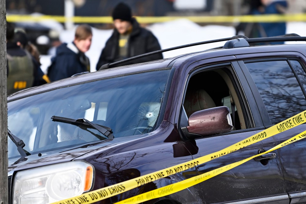 Police tape surrounds a vehicle suspected to be involved in a shooting by an ICE agent during federal law enforcement operations in Minneapolis, NM.
