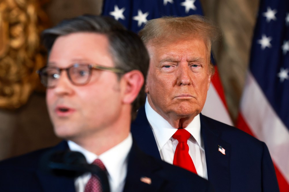 President Donald Trump listens as Speaker of the House Mike Johnson speaks during a press conference on April 12, 2024, in Palm Beach, Fla.