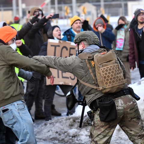 Protesters clash with federal agents outside the Bishop Henry Whipple Federal Building in Saint Paul, Minn.