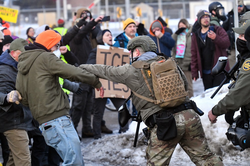 Protestors clash with federal agents outside the Bishop Henry Whipple Federal Building in Saint Paul, MN.