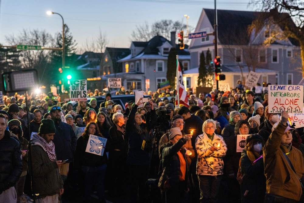 A large crowd in Minneapolis holds a vigil in protest of deadly ICE shooting of a woman earlier in the day.