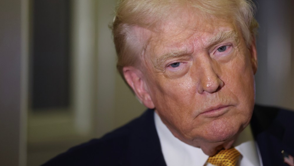 President Donald Trump wearing a gold tie.