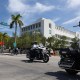 Officers drive past a white courthouse in Florida.