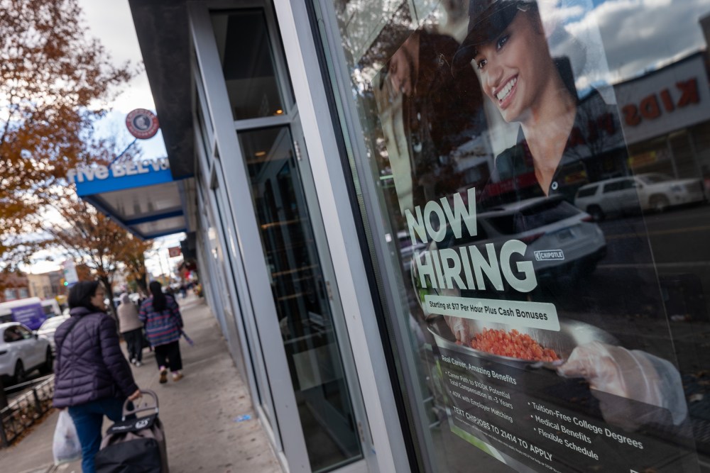 A &ldquo;Now Hiring&rdquo; sign is seen on a Chipotle window.