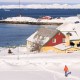 A man walks through the snow towards the bay area on March 30, 2025 in Nuuk, Greenland.
