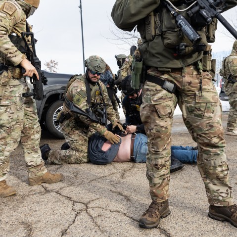 Federal agents arrest protestors outside an ICE facility in Minneapolis on Jan. 9.