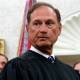 Justice Alito seen in the Oval Office. His face looks nervous.