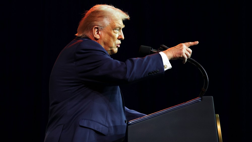 President Donald Trump addresses a House Republican retreat.
