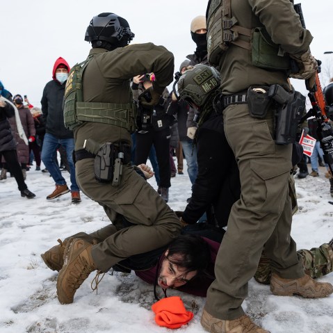 Several federal agents attempt to make an arrest at a protest against the ICE presence in Minneapolis.