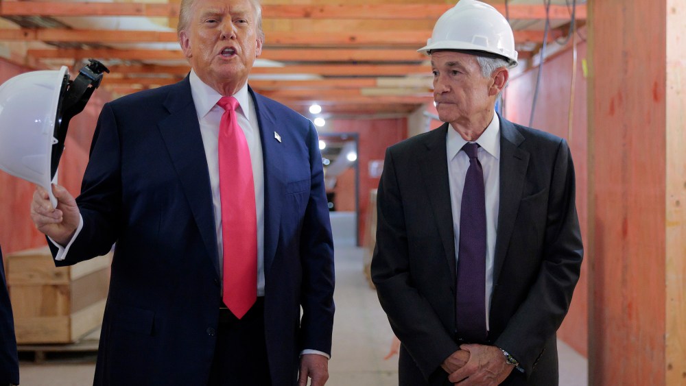 President Donald Trump, left, tours the Federal Reserve’s headquarters.