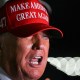 President Donald Trump wearing a "Make America Great Again" hat.