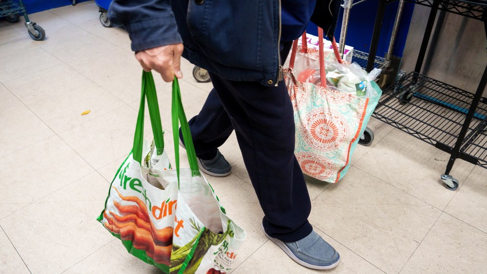 A resident carries grocery bags on Oct. 31, 2025, in New York.