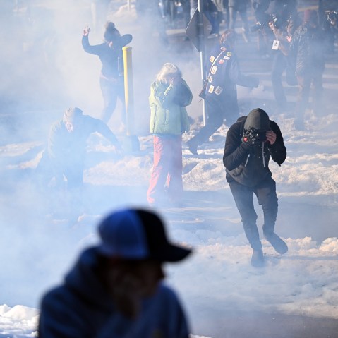 Federal agents clash with residents and rapid responders as they deploy tear gas in Minneapolis, MN.
