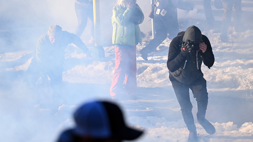 Federal agents clash with residents and rapid responders as they deploy tear gas in Minneapolis, MN.