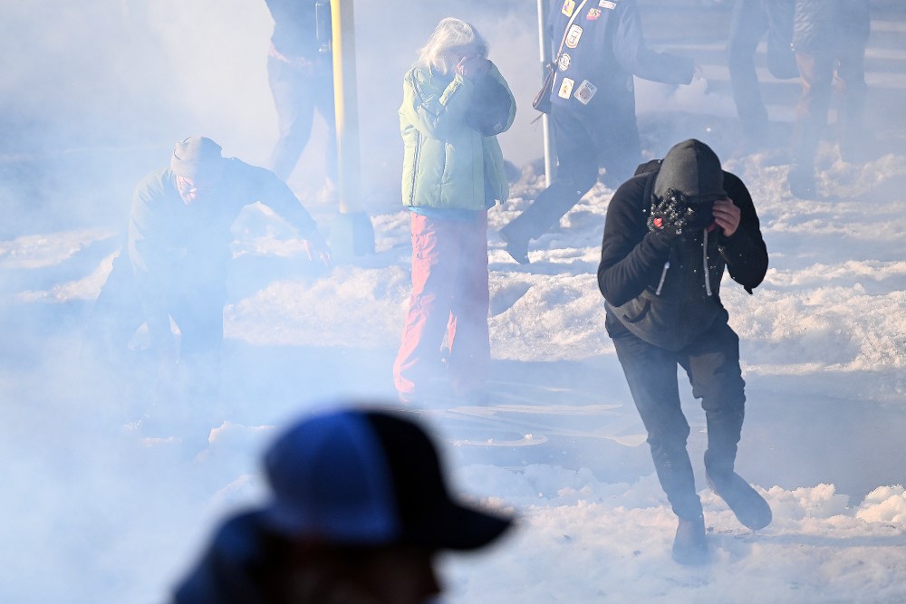 Federal agents clash with residents and rapid responders as they deploy tear gas in Minneapolis, MN.