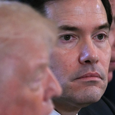 A closeup of Marco Rubio&rsquo;s face during a meeting in the White House. To his left, Donald Trump can be seen out of focus.