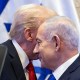 President Donald Trump's face is obscured behind Benjamin Netanyahu's.