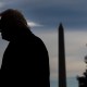 A silhouette of President Donald Trump on the South Lawn of the White House.
