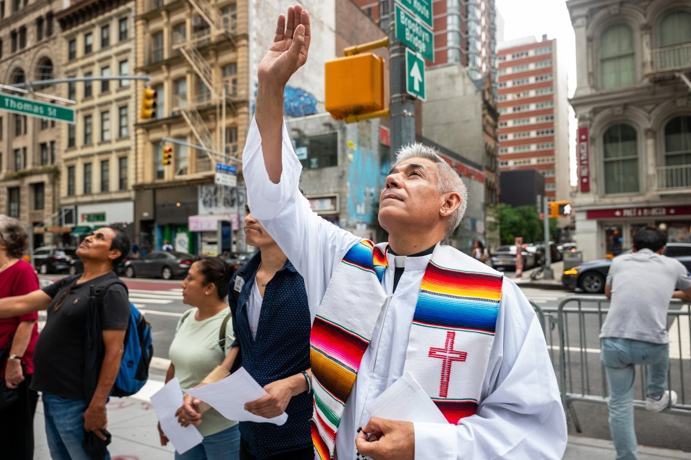 Members of the New Sanctuary Coalition (NSC) participate in a weekly prayer outside of immigration court at the Jacob K. Javits Federal Building on July 10, 2025, in New York City.