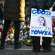 A person holds a sign reading "Good Rest in Power" during a vigil on Jan. 14, 2026, in Minneapolis.